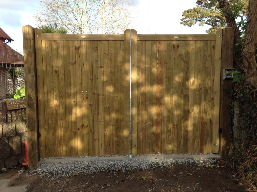 Tanalised timber gates, with hydraulic rams. South West Garage Doors