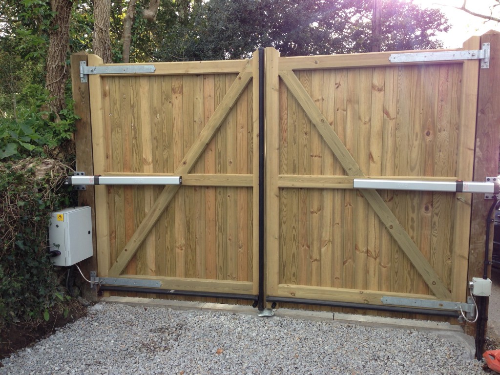 Tanalised timber gates, with hydraulic rams. South West Garage Doors