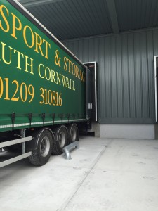 Docked lorry into flap shelter being loaded